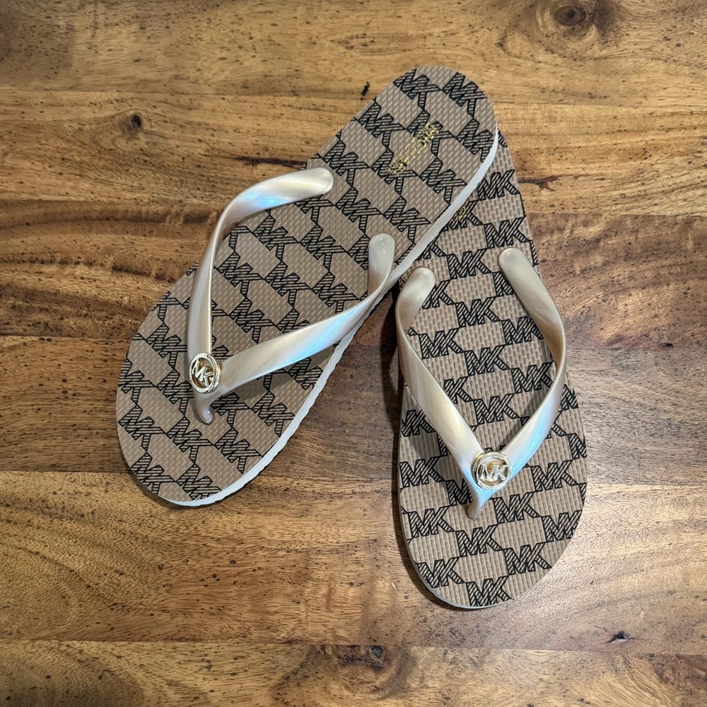 Michael Kors Gold Flip Flops with Gold MK Logo. NWOT. Size 10